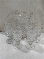 Cut glass pitcher with six matching glasses