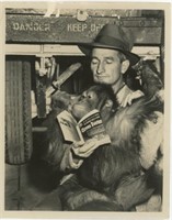 8x10 Chimp and man reading Circus Doctor book