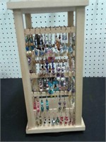 Pierced earrings and wood display rack
