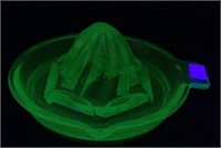 Green uranium glass juicer with 5 inch diameter.