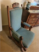 ANTIQUE ROCKER WITH INTRICATE WOODWORKING