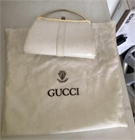 White evening bag, Gucci dust bag