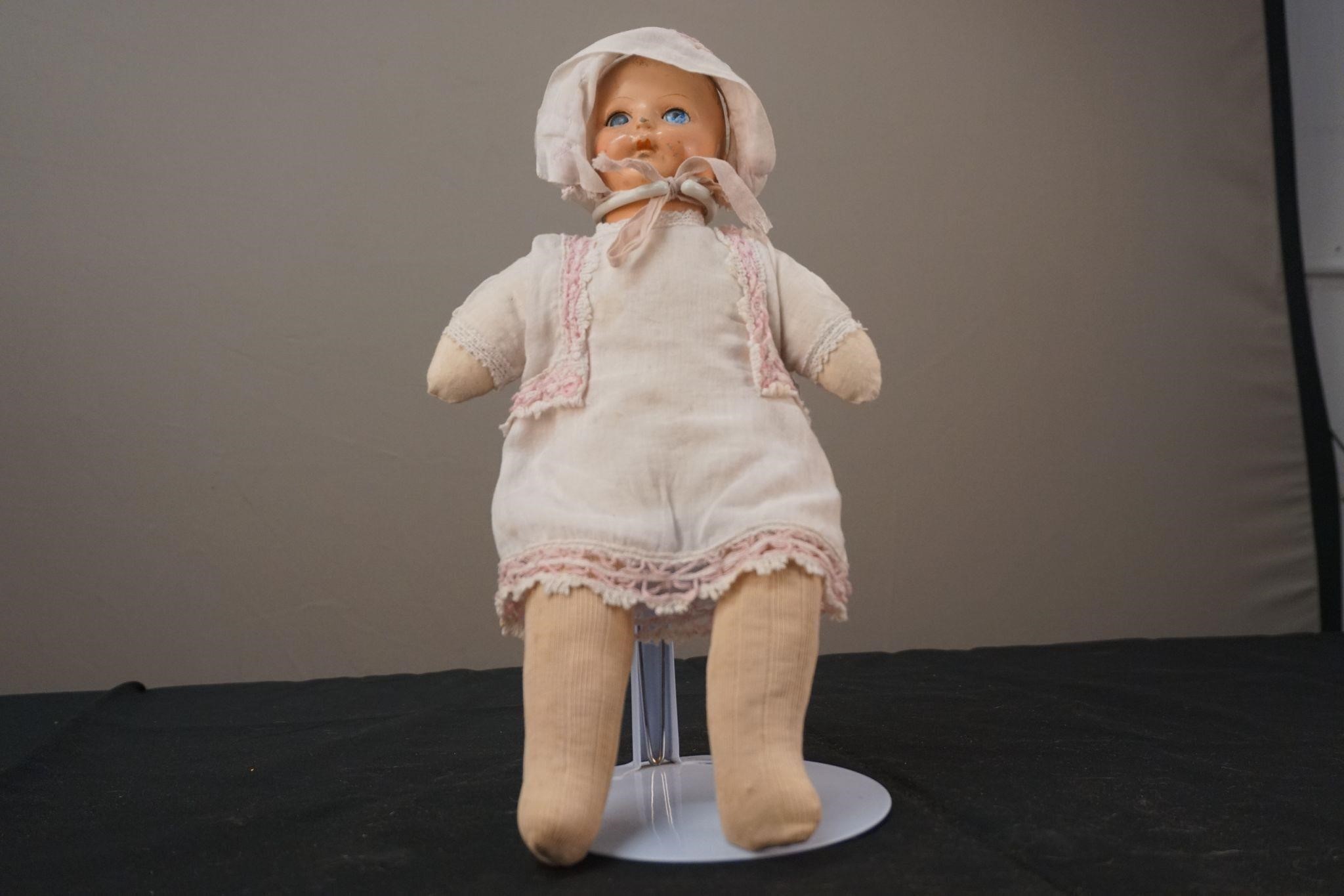Antique Baby Doll with White and Pink Outfit