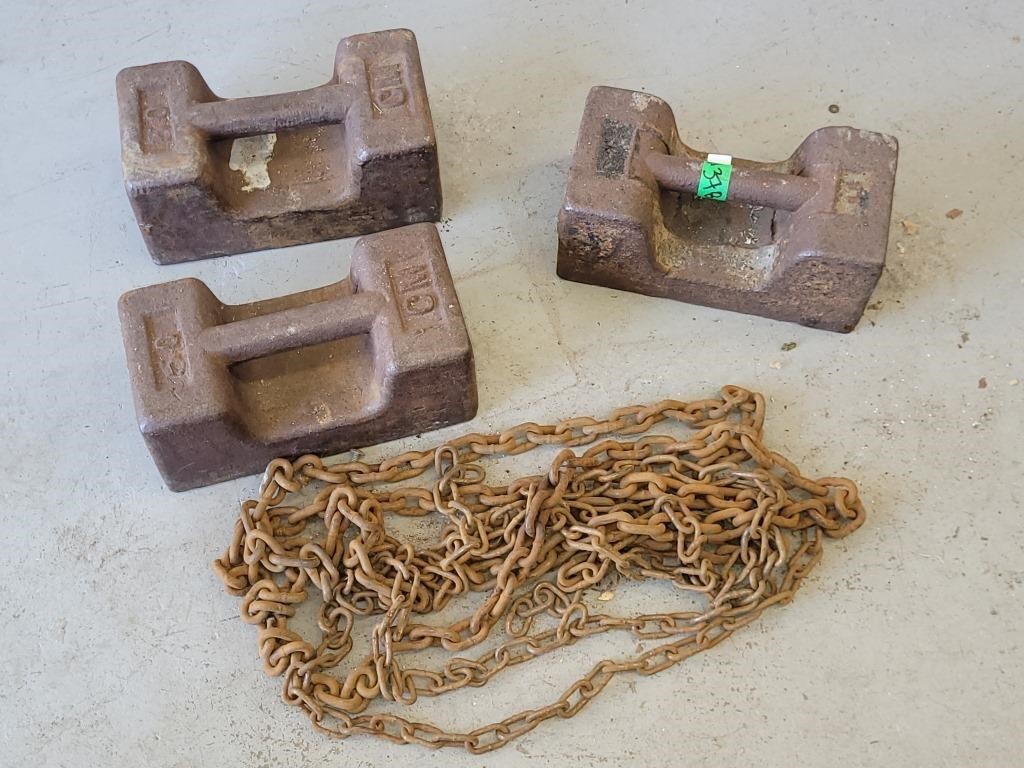 3 - 50 LB WEIGHTS AND CHUNK OF CHAIN