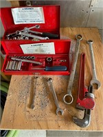 Two small toolboxes with sockets and wrenches