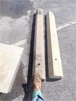 Concrete Parking Bumper with Reids Boot on it