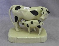 RW black spotted cow and calf on base