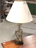 Glass electric lamp with metal base