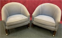 Pair of mid century modern upholstered rolling