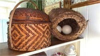 Two large baskets, one with two large ostrich