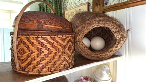 Two large baskets, one with two large ostrich