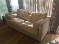 Suede sofa with cushions