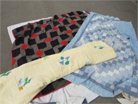 assorted vintage quilts