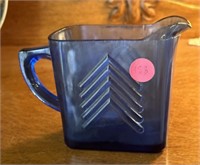 Small blue glass pitcher (living room)