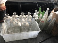 Group of pop bottles and other bottles