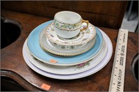 Stack of Various Antique Plates and Teacup