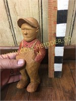 Handcarved farmer in overalls