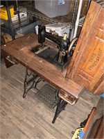Old singer sewing machine and cabinet
