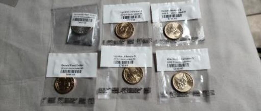 5 - Uncirculated Presidential $1 coins.  1 -