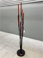 Black candelabra with candles. 12x63in