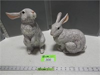 Ceramic rabbits; one has been repaired