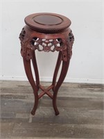 Carved wood plant stand