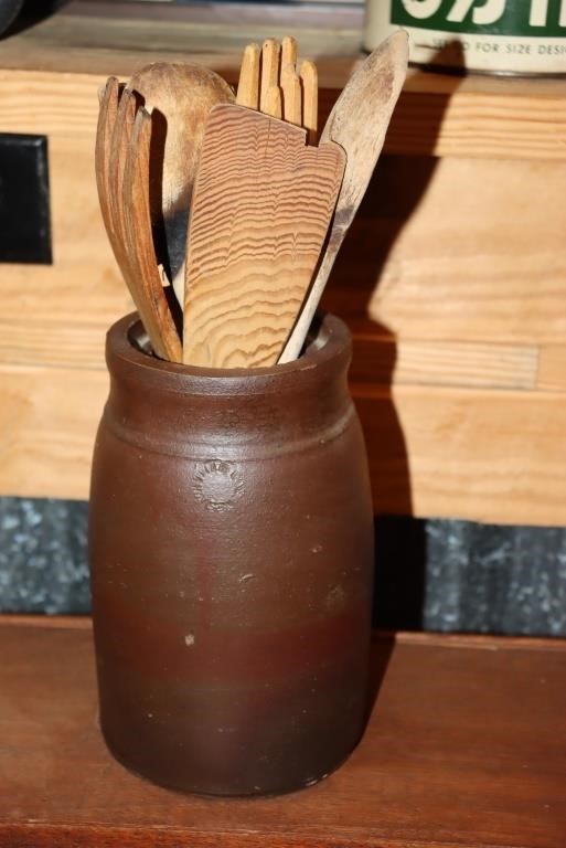 Stoneware pottery crock with wooden utensils