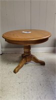 Round oak end table.