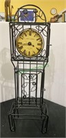 Metal ornamental clock. By Poirot & Germain. .