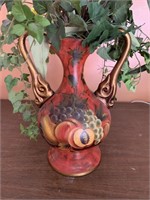 Decorative urn with fruit design and artificial