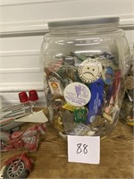 Jar of key chains and misc. items