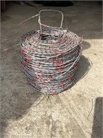 Partial roll of barbed wire