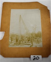 Photo of men at an oil well
