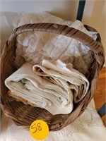 BASKET OF LINENS AND TABLECLOTHS