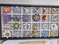 flat of brooches