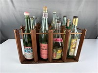 Twelve empty liquor bottles crate