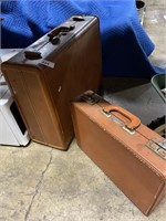 Pair of Fuce brown leather suit cases.
