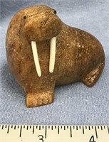 3" fossilized bone carving of a walrus with walrus