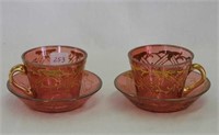 Pair of Cranberry decorated demitasse cup &