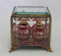 Casket w/4 cranberry decorated perfumes