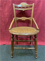 Eastlake style dining chair with woven seat