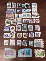 Large lot of VTG stamps still on envelope paper