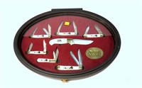 Set of seven NWTF knives, six are folders,