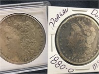 Lot of 2 Morgan silver dollars with protectors