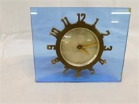 Eight day clock in blue Lucite, 5" H
