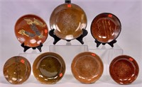 7 Redware plates - 8.25" plate has design (some
