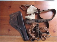 lot of western holsters, leather and belts