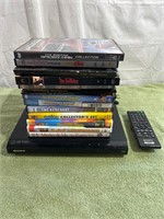 Sony DVD player with remote and stack of DVDs