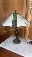 Leaded glass lamp with cast base