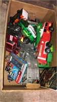 Large box of assorted cars trucks and other
